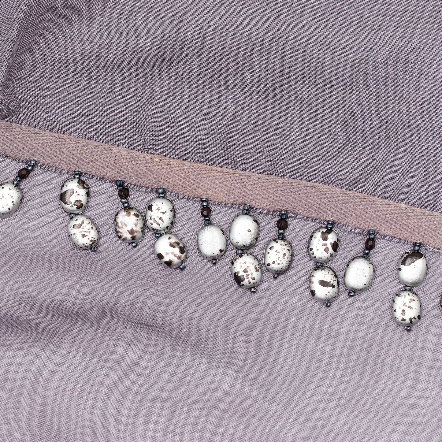 Minimal gray X beads